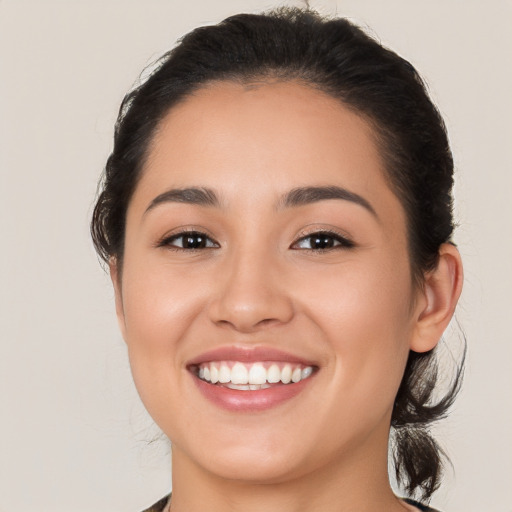 Joyful white young-adult female with medium  brown hair and brown eyes