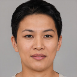 Joyful asian young-adult female with short  black hair and brown eyes