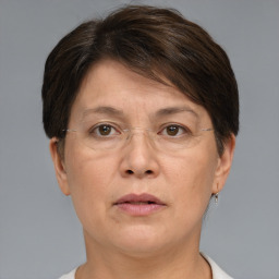 Joyful white adult female with short  brown hair and brown eyes