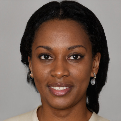 Joyful black young-adult female with medium  black hair and brown eyes
