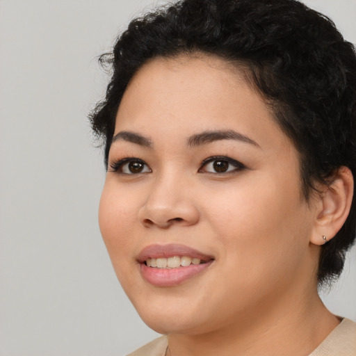 Joyful white young-adult female with medium  black hair and brown eyes