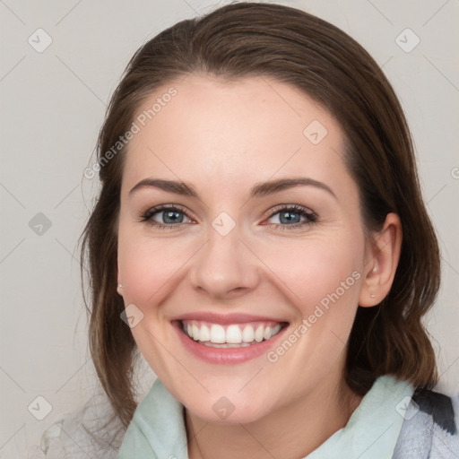 Joyful white young-adult female with medium  brown hair and blue eyes