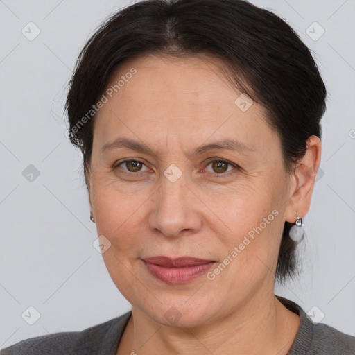 Joyful white adult female with medium  brown hair and brown eyes