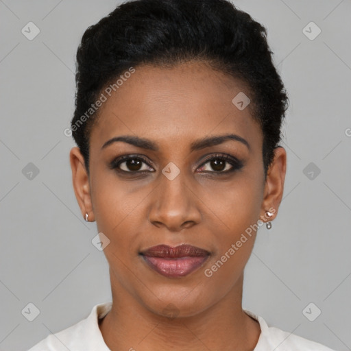 Joyful black young-adult female with short  black hair and brown eyes