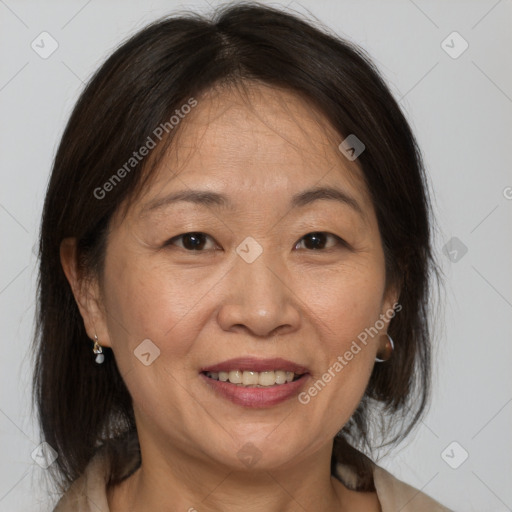 Joyful white adult female with medium  brown hair and brown eyes