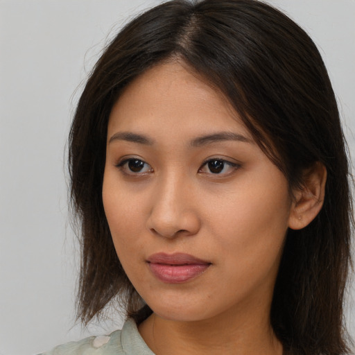 Neutral asian young-adult female with long  brown hair and brown eyes