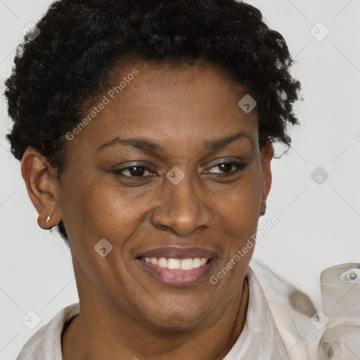 Joyful black adult female with short  brown hair and brown eyes