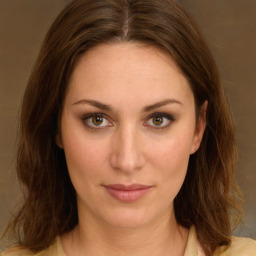 Joyful white young-adult female with medium  brown hair and green eyes