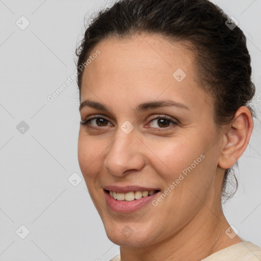 Joyful white adult female with short  brown hair and brown eyes