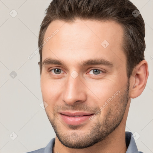 Joyful white young-adult male with short  brown hair and brown eyes