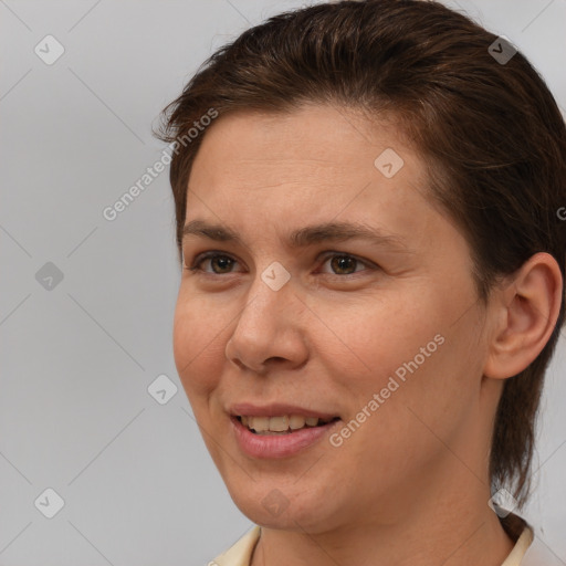 Joyful white adult female with medium  brown hair and brown eyes