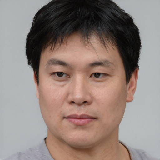 Neutral asian young-adult male with short  black hair and brown eyes