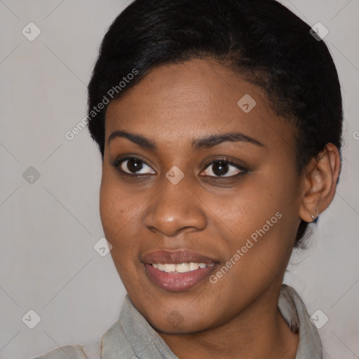 Joyful black young-adult female with short  black hair and brown eyes