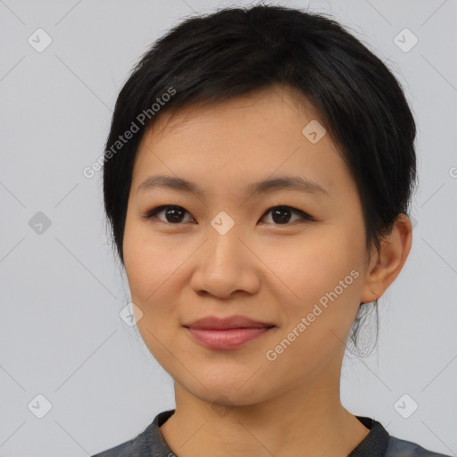 Joyful asian young-adult female with medium  black hair and brown eyes