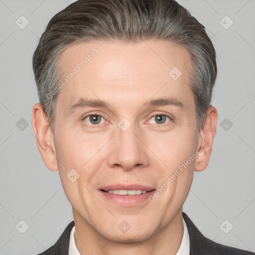 Joyful white adult male with short  brown hair and grey eyes