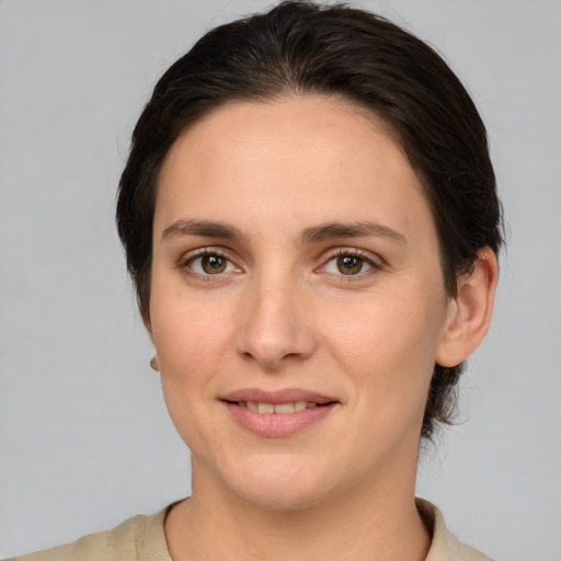 Joyful white young-adult female with medium  brown hair and brown eyes