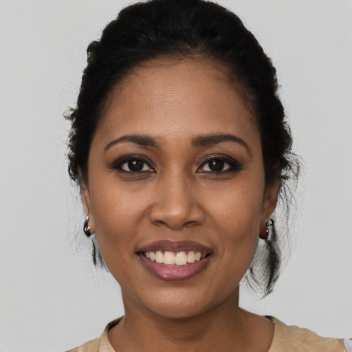 Joyful latino young-adult female with medium  black hair and brown eyes