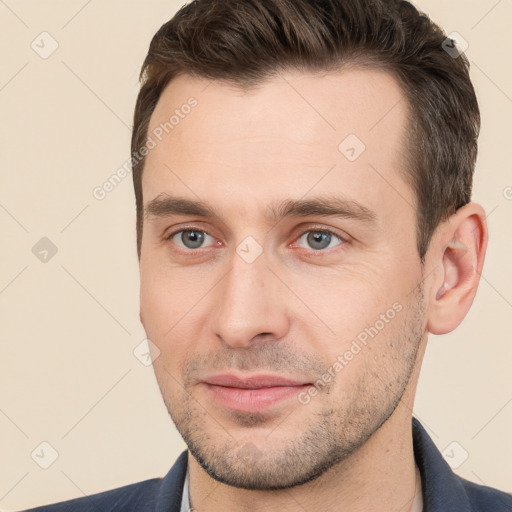 Joyful white young-adult male with short  brown hair and brown eyes