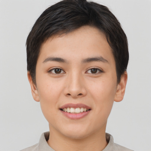 Joyful asian young-adult female with short  brown hair and brown eyes