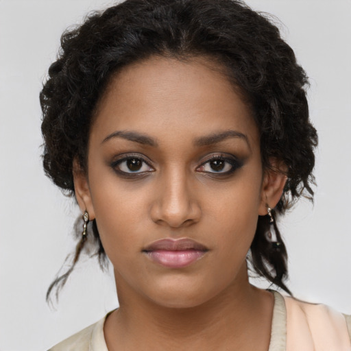 Neutral black young-adult female with long  brown hair and brown eyes