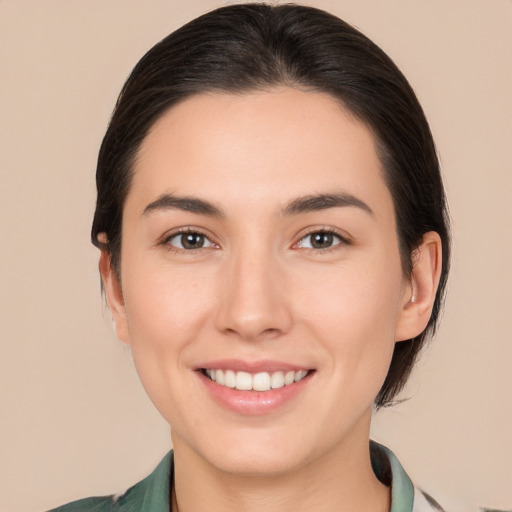 Joyful white young-adult female with medium  brown hair and brown eyes