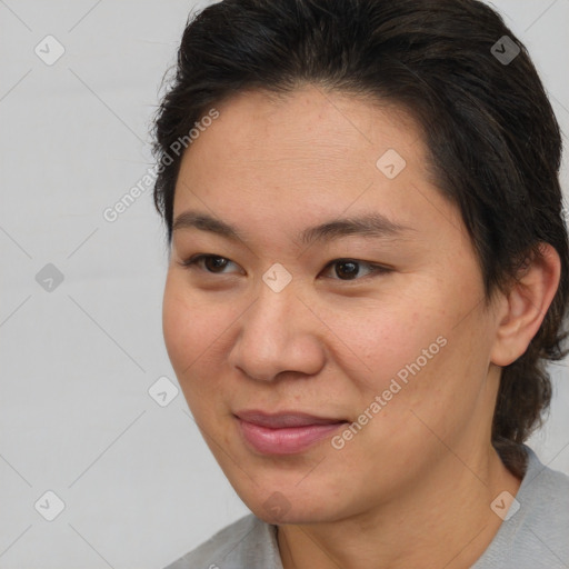 Joyful asian young-adult female with medium  brown hair and brown eyes