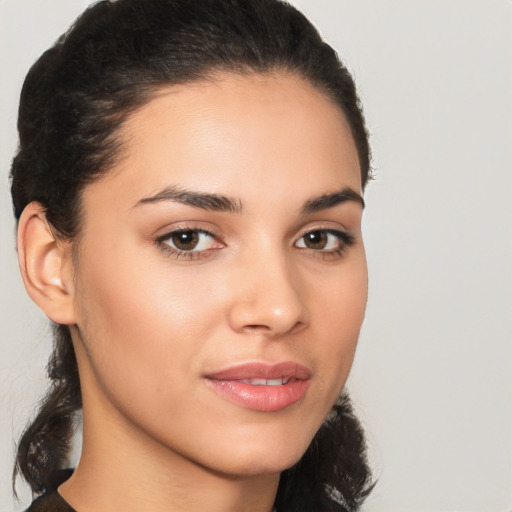 Joyful latino young-adult female with medium  brown hair and brown eyes