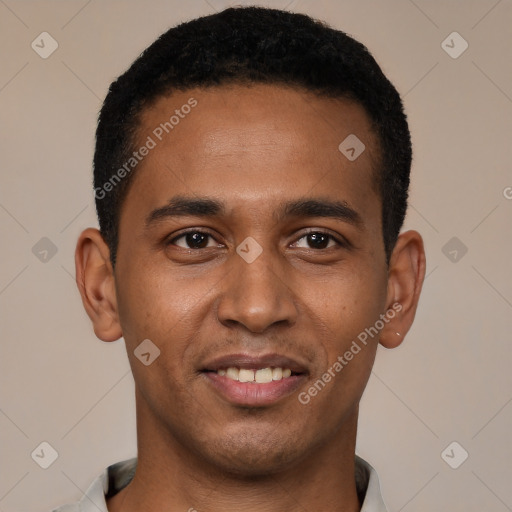 Joyful black young-adult male with short  black hair and brown eyes