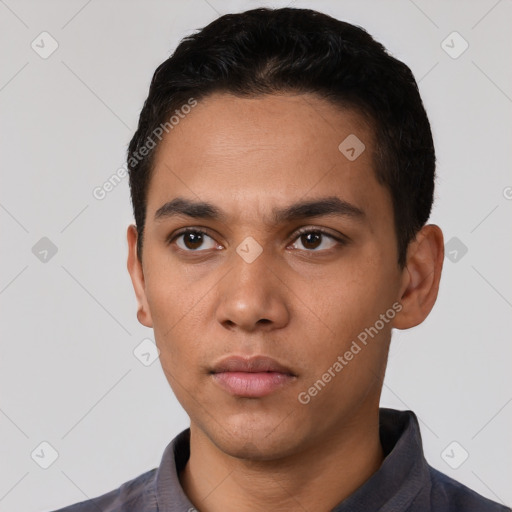 Neutral latino young-adult male with short  black hair and brown eyes