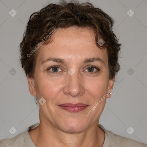 Joyful white adult female with short  brown hair and brown eyes