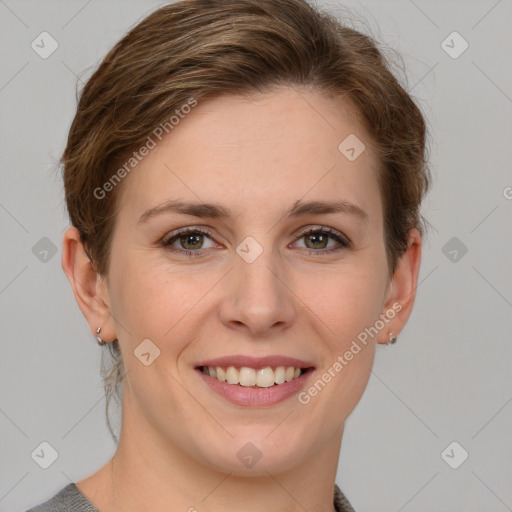 Joyful white young-adult female with short  brown hair and grey eyes