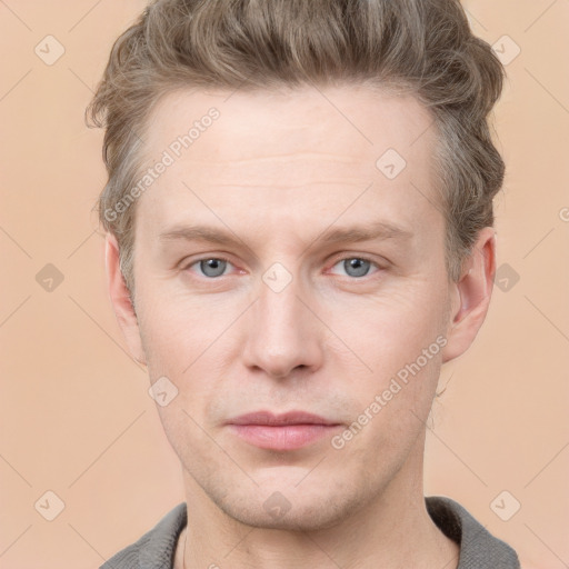 Joyful white adult male with short  brown hair and grey eyes