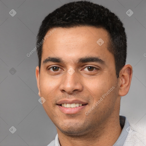 Joyful white young-adult male with short  black hair and brown eyes