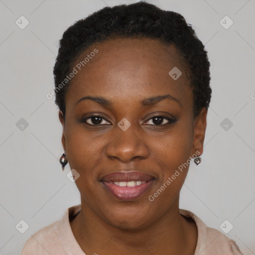 Joyful black young-adult female with short  black hair and brown eyes