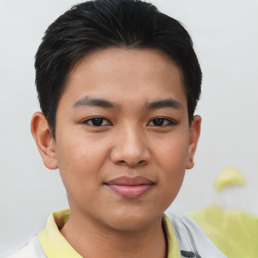 Joyful latino young-adult male with short  brown hair and brown eyes
