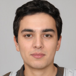 Neutral white young-adult male with short  black hair and brown eyes