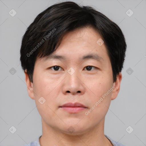 Neutral asian young-adult male with short  brown hair and brown eyes