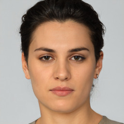 Neutral white young-adult female with short  brown hair and brown eyes