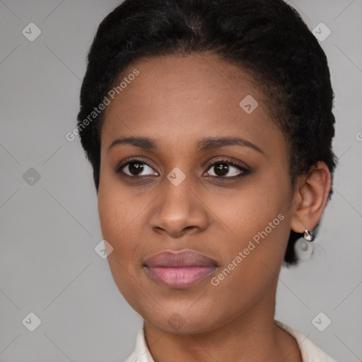 Joyful black young-adult female with short  brown hair and brown eyes