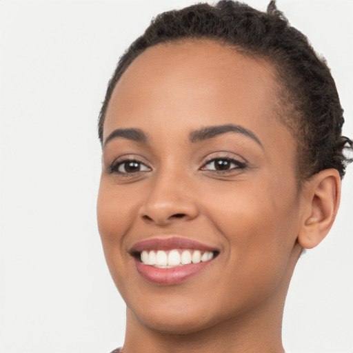 Joyful latino young-adult female with short  brown hair and brown eyes