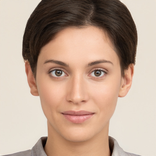 Joyful white young-adult female with short  brown hair and brown eyes