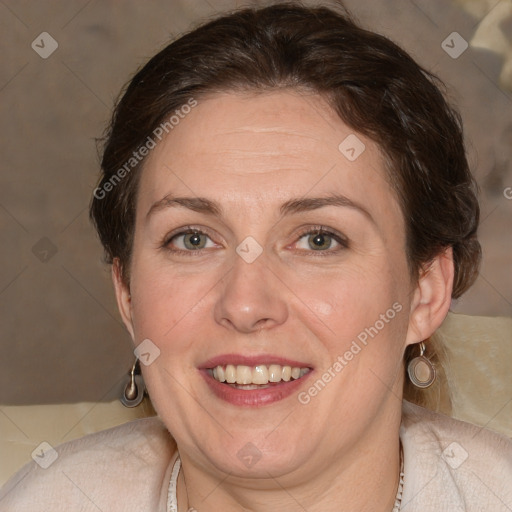 Joyful white adult female with medium  brown hair and blue eyes