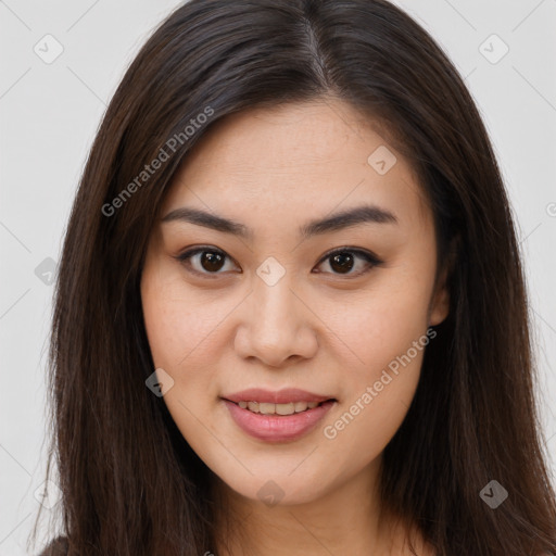 Joyful asian young-adult female with long  brown hair and brown eyes