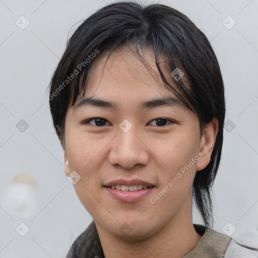 Joyful asian young-adult male with medium  brown hair and brown eyes