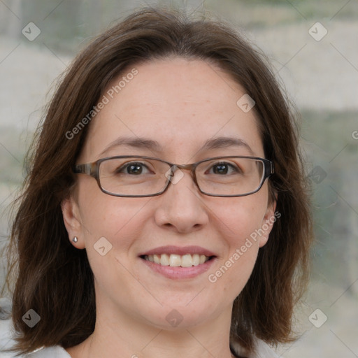 Joyful white adult female with medium  brown hair and blue eyes