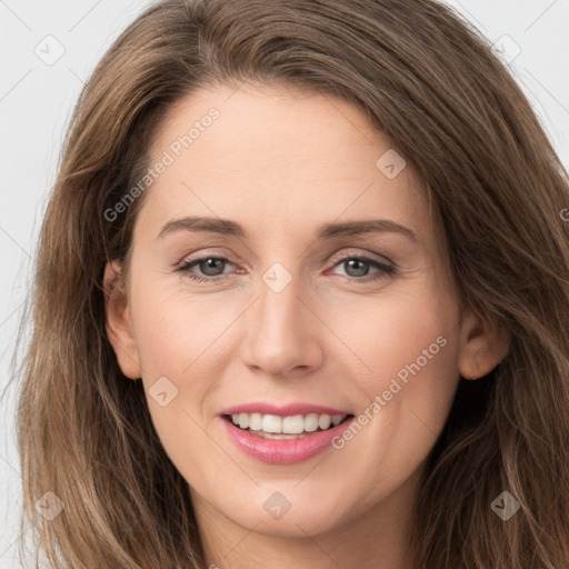 Joyful white young-adult female with long  brown hair and grey eyes