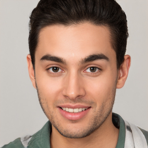 Joyful white young-adult male with short  brown hair and brown eyes