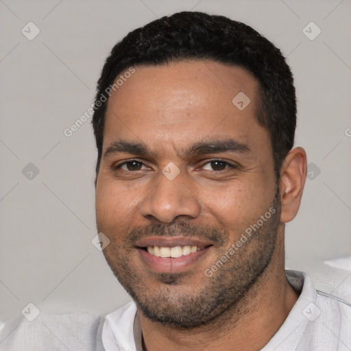 Joyful white young-adult male with short  black hair and brown eyes