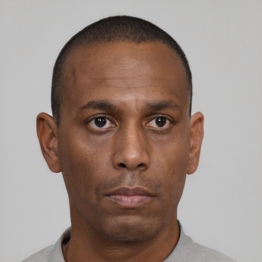 Neutral black adult male with short  black hair and brown eyes