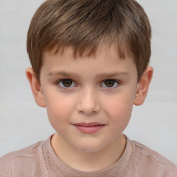 Joyful white child male with short  brown hair and brown eyes